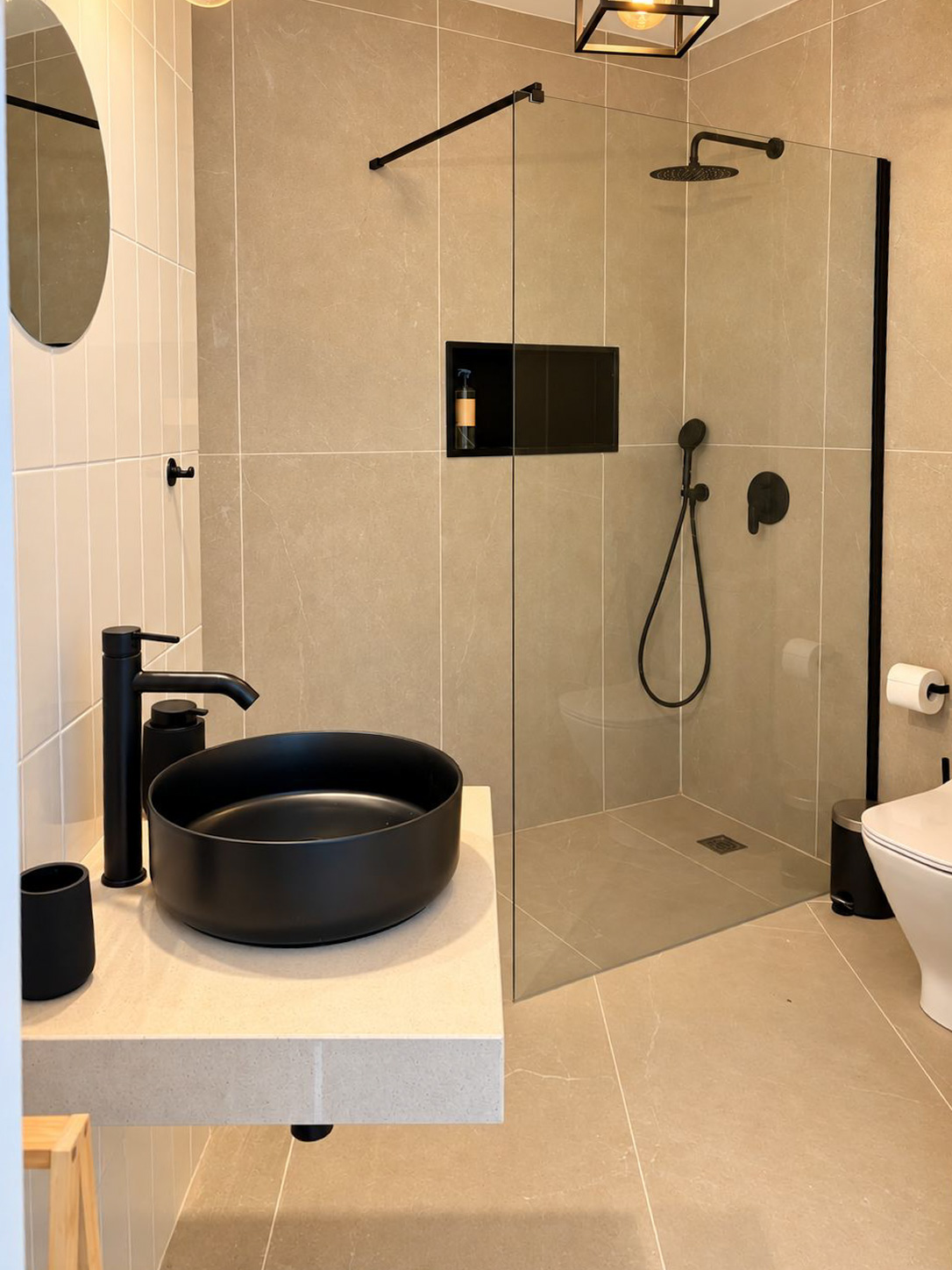 Ensuite bathroom with black fixtures