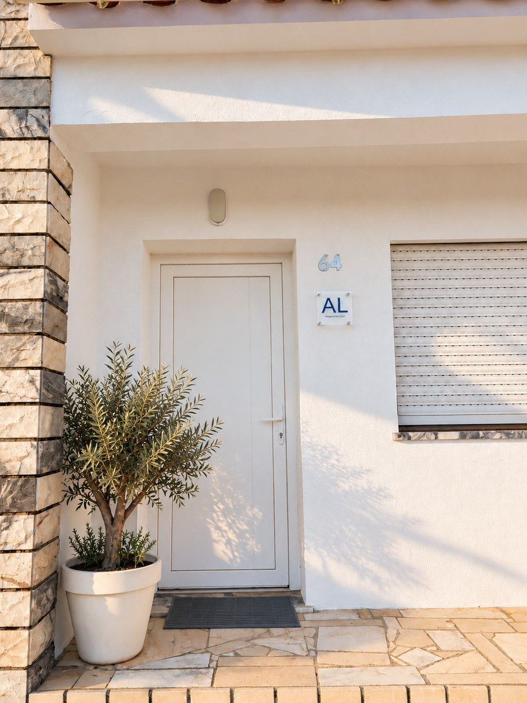 Front entrance with an olive tree